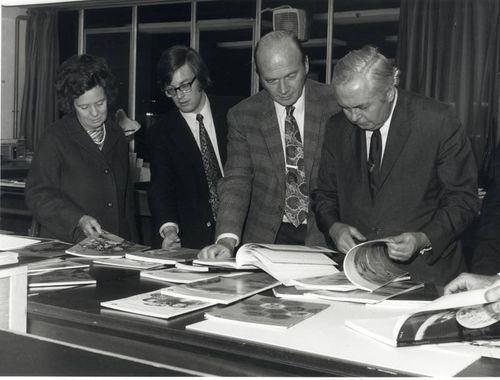 Harold Wilson and Mary Wilson examine course units with Vice Chancellor Walter Perry and Sam Crooks.