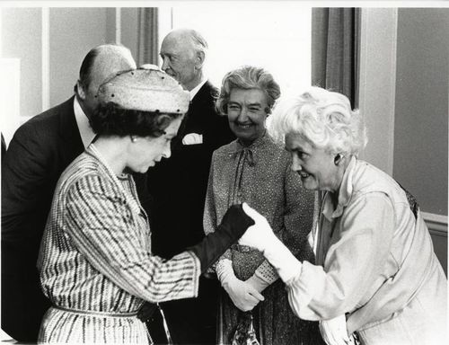 Jennie Lee meeting and taking The Queen's hand  on the occasion of Her Majesty's visit to The Open University on 27 June 1979.