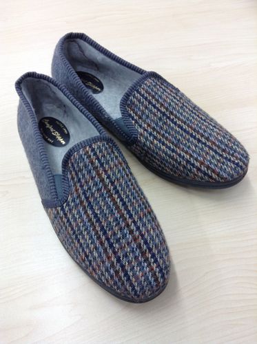 OU slippers held in the Open University Archive. 100 pairs of carpet slippers were purchased for the staff of the Open University in 1969/70 to protect the carpets in the new buildings from the mud of the construction work on campus.  