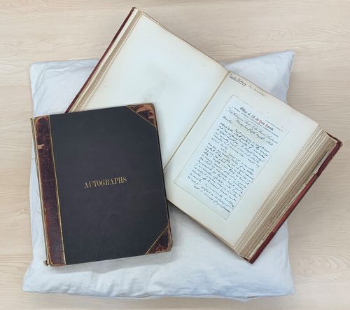 The Sampson Low Collection - a collection of more than 200 letters written by clients and contemporaries of the publisher Sampson Low, preserved in two volumes. The letters date between 1828 and 1877. This image shows one volume open to display a letter from Charles Dickens.
