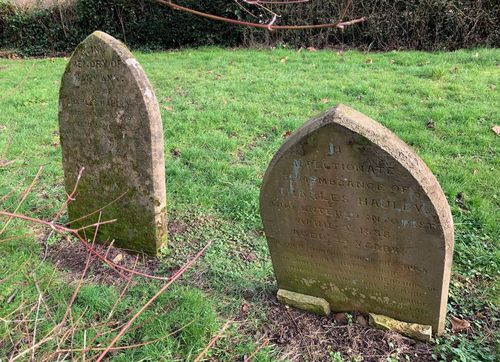 The graves of Mary Ann Hauley and Charles Hauley in St Michael's churchyard, Walton Hall, taken in 2023.