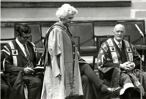 Jennie Lee at the first Open University graduation ceremony on 23 June 1973 when she was awarded an honorary doctorate. Seated in the photograph are University Secretary Anastasios Christodoulou and Chancellor Lord Gardiner. 