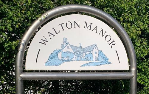 The sign outside the site of Walton Manor which is now the location of an Animal Health Pharmaceutical Company. The sign depicts an image of Walton Manor.