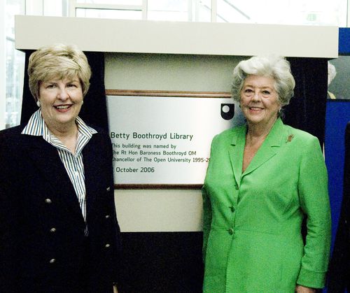 Betty Boothroyd and Brenda Gourley standing by the name plaque of the Betty Boothroyd Library Building on the OU campus in Milton Keynes, during the building naming ceremony.
