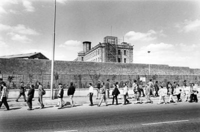 This image is owned by Coiste na nlarchimi the Republican ex-prisoners association. It shows people demonstrating outside the stone walls of Portlaoise Prison in Portlaoise County Laois Ireland in the 1970s.