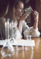 view image of Student working at home with a McArthur microscope