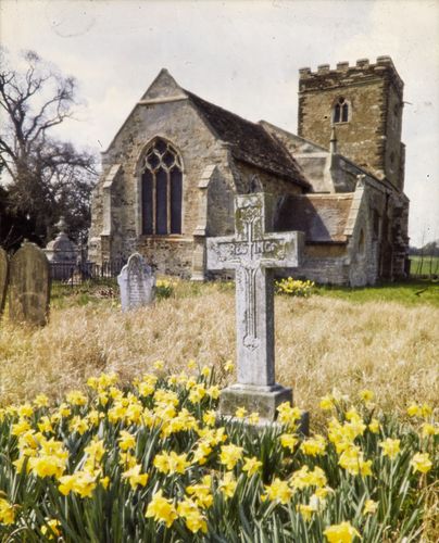 The grave of George and Priscilla Underwood with St Michael's Church behind, photographed in about 1970 when The Open University first took over the Walton Hall estate.  